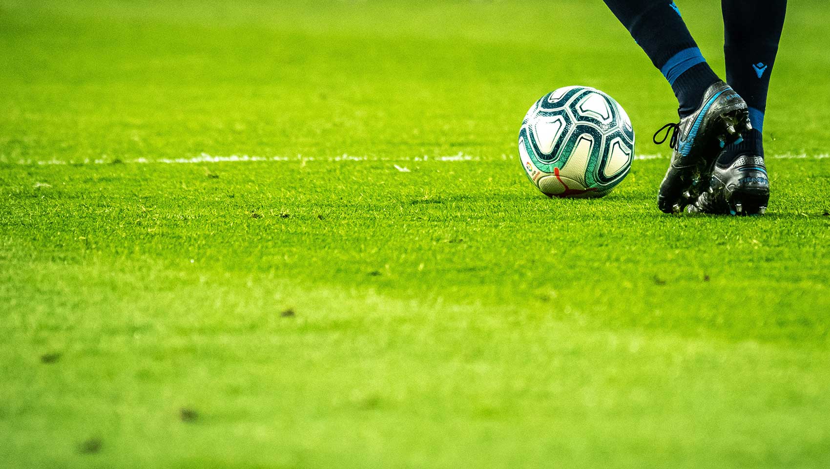 kicking soccer ball