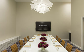 The Everly boardroom with media screen at end of table