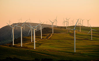 wind turbines at sunset